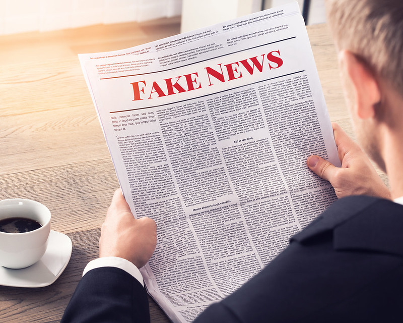 Fake+News+-+Person+Reading+Fake+News+Article+by+mikemacmarketing+is+licensed+under+CC+BY+2.0