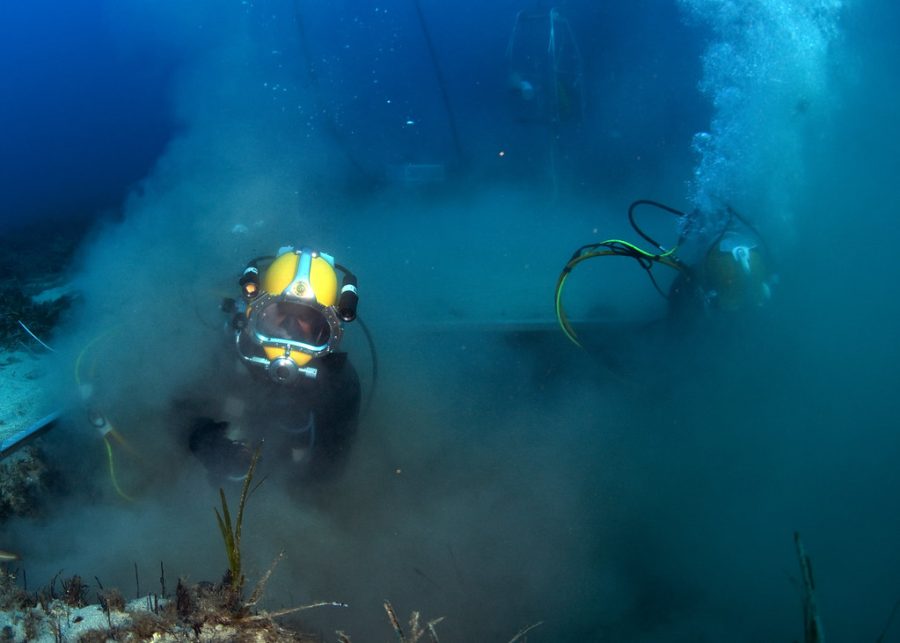 US Navy Divers, alongside the Joint POW/MIA Accounting Command, search for an unaccounted-for service member who went missing during World War II. [Image 3 of 4] by DVIDSHUB is licensed under CC BY 2.0