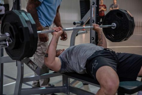 Zane Adams, 1st Engineer Battalion, Fort Riley, Kansas, completes the second event, a 375 pound benchpress, in the 1000 Pound Challenge June, 25 2019, at Mihail Kogalniceanu Air Base, Romania.