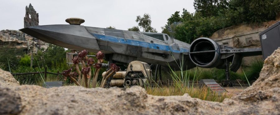 a star wars vehicle sits in a rocky area