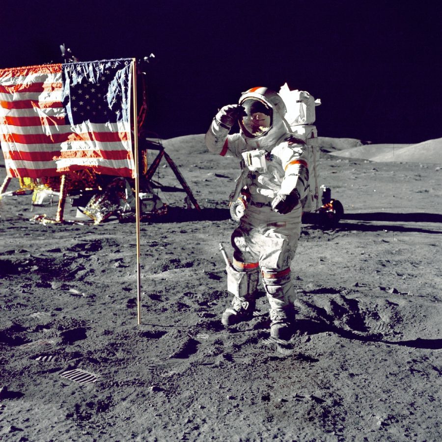 astronaut+standing+on+moon+beside+U.S.A.+flag