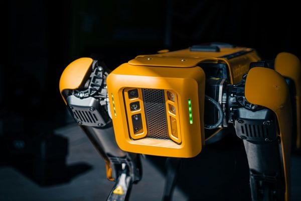a close up of a robot that is yellow