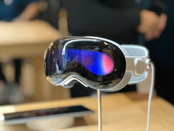 a pair of goggles sitting on top of a wooden table