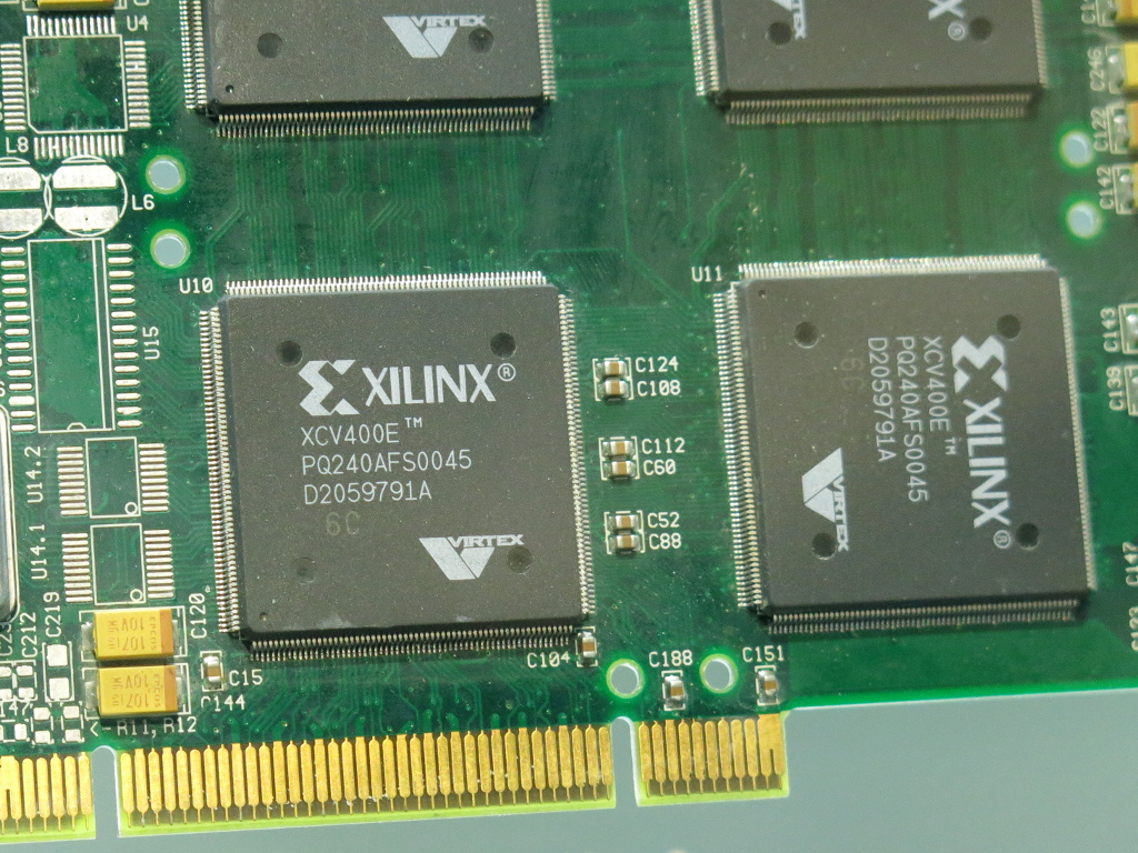 A printed circuit board with four Xilinx FPGAs Virtex-E XCV400E-PQ240.