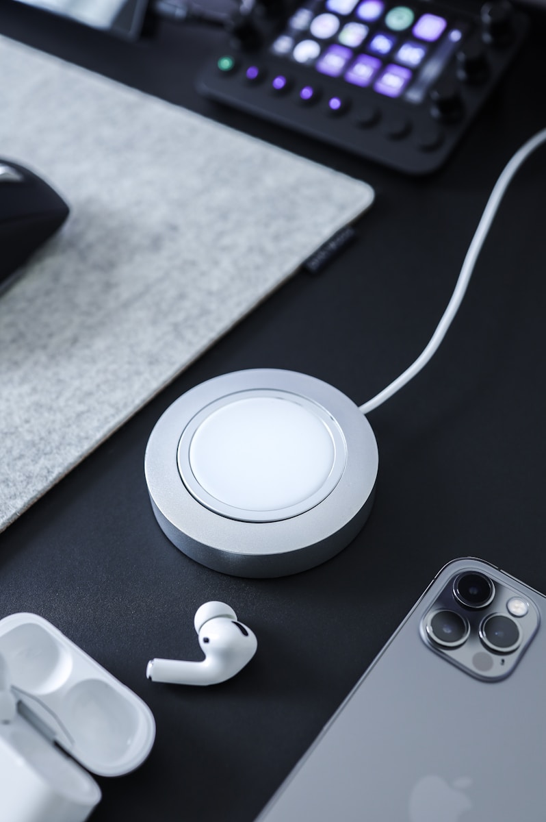 white+round+corded+device+on+table