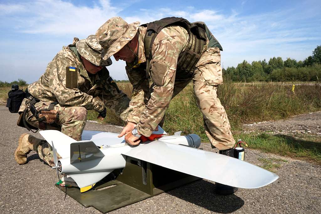 Ukrainian soldiers packing up a drone