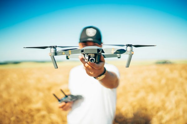 shallow focus photography of quadcopter in field