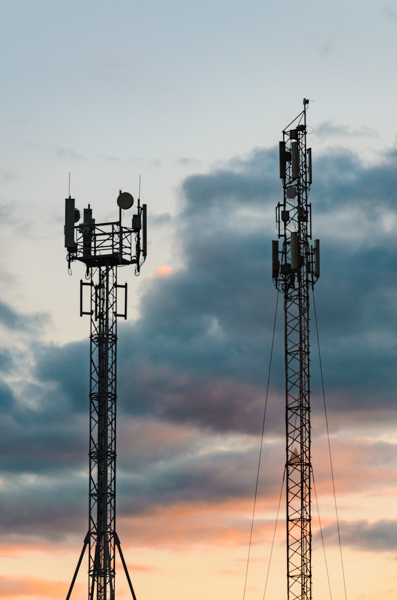 a couple of cell towers sitting next to each other