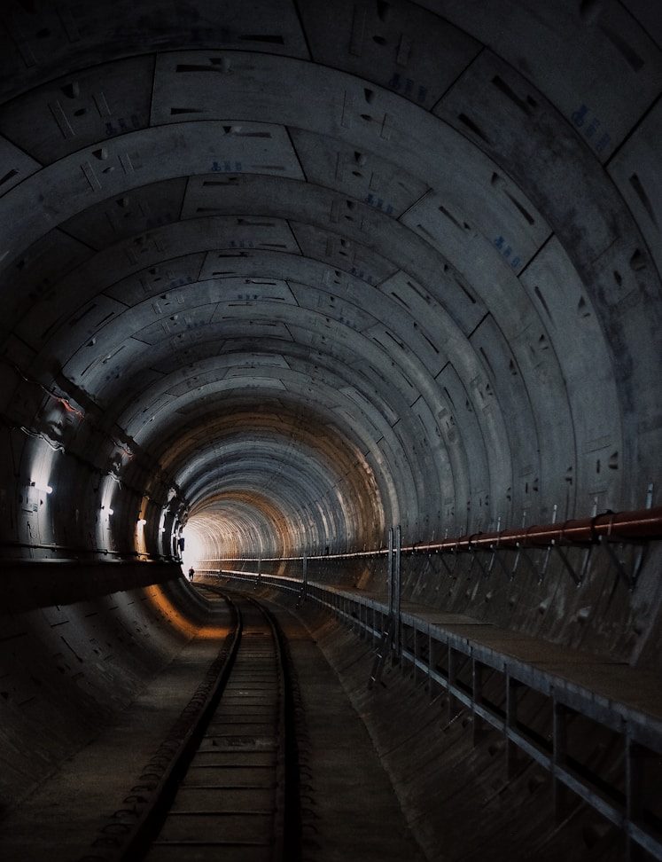 photo of train rail tunnel