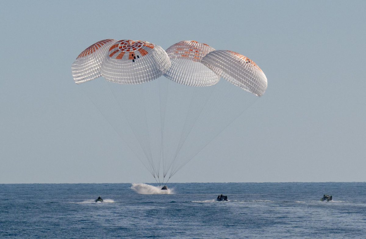 A photograph of the landed capsule in the Gulf of Mexico