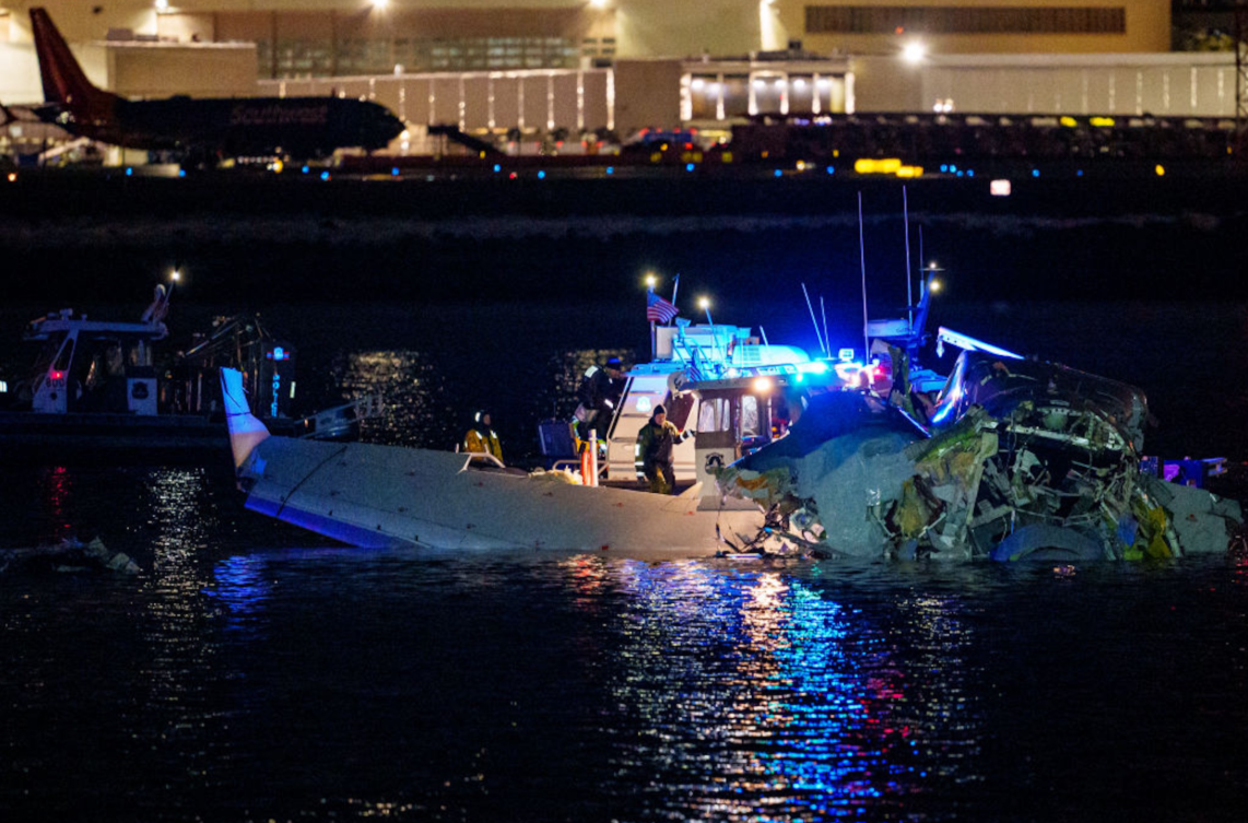 A picture of Flight 5342 as the wrecked plane is being taken out of the water. 