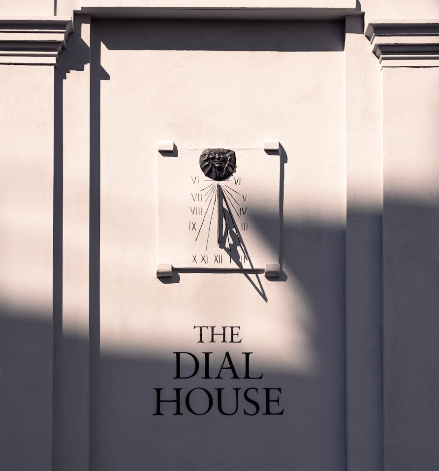 the dial house sign on the side of a building