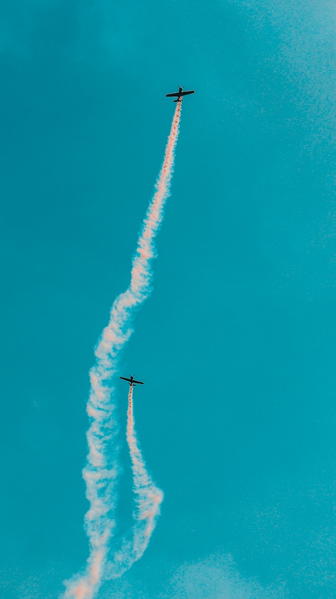 two planes flying on air at daytime