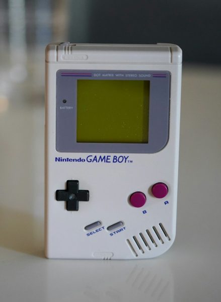 white nintendo game boy on white table