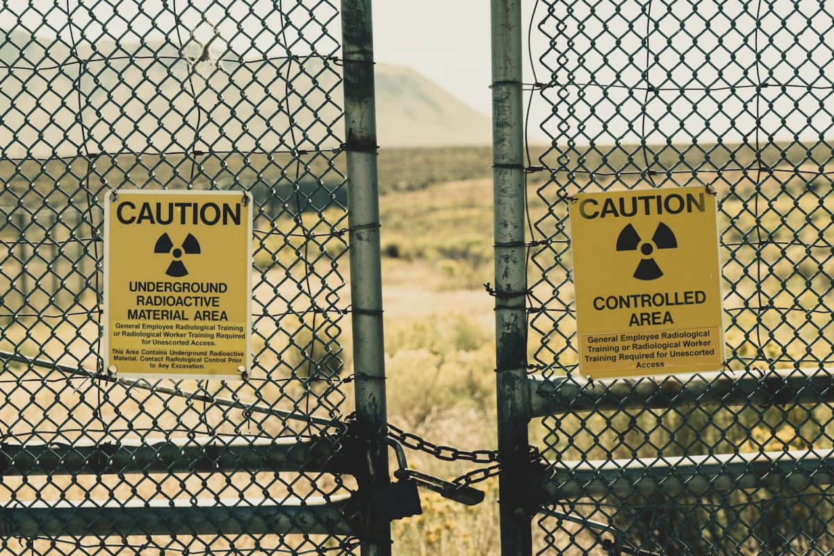 a couple of signs that are on a fence