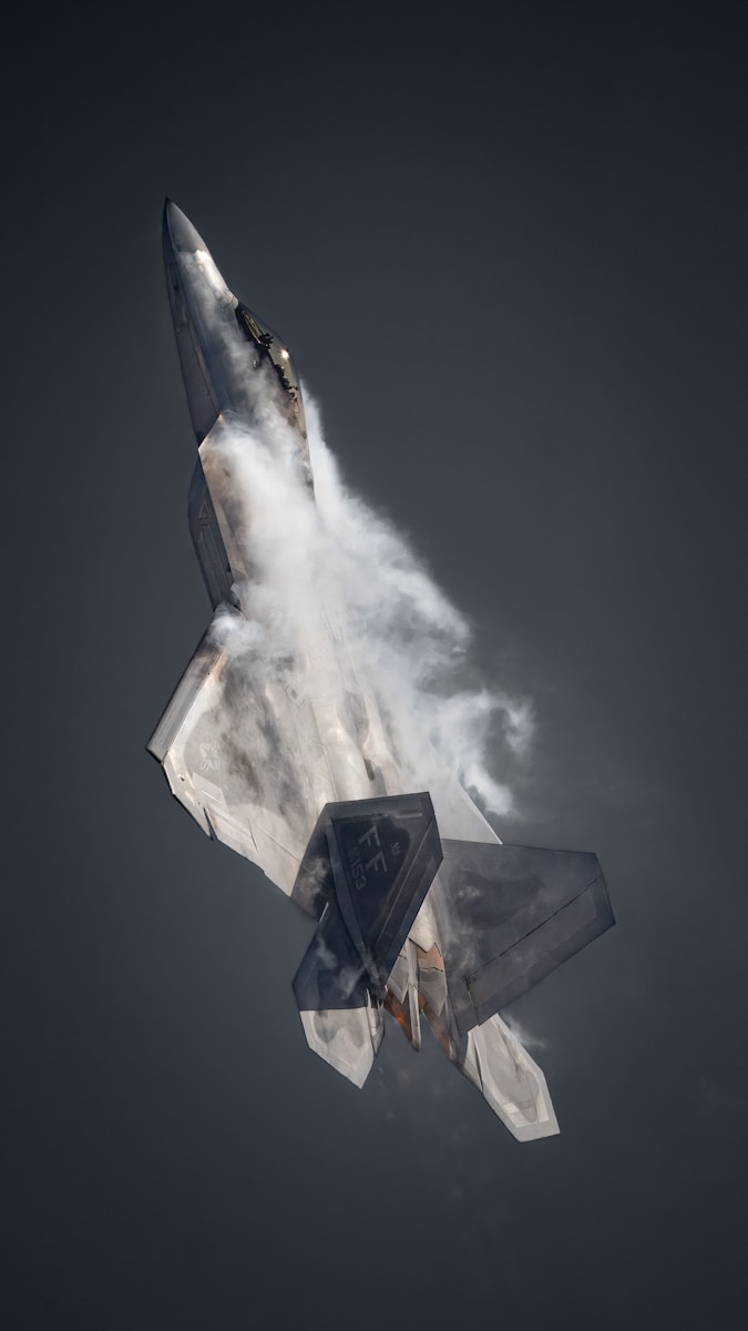 A fighter jet is flying through the air