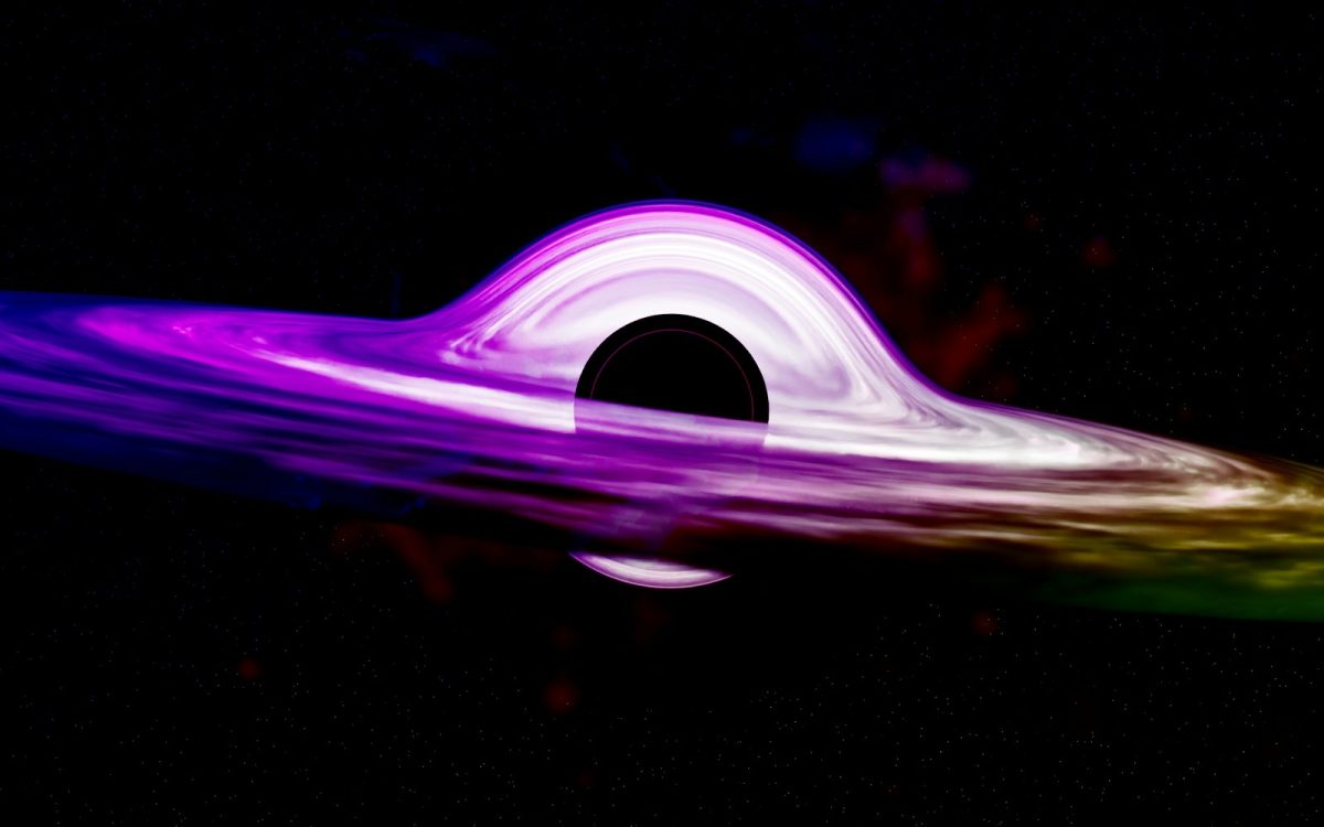 a purple and green object floating in the air