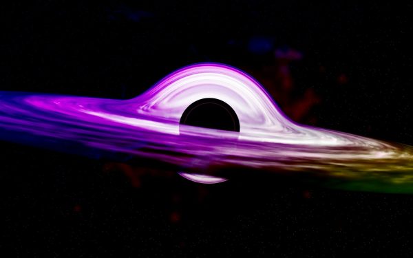 a purple and green object floating in the air