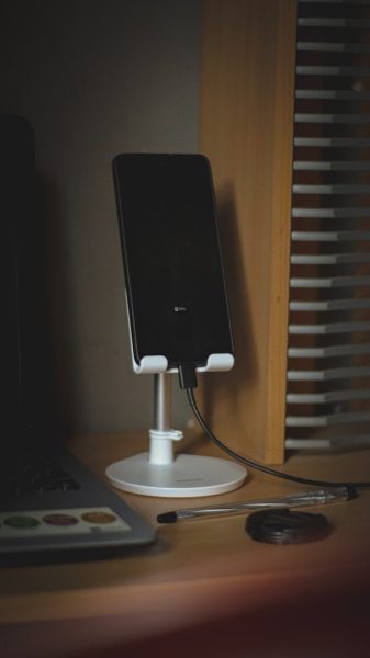 black android smartphone on white round table